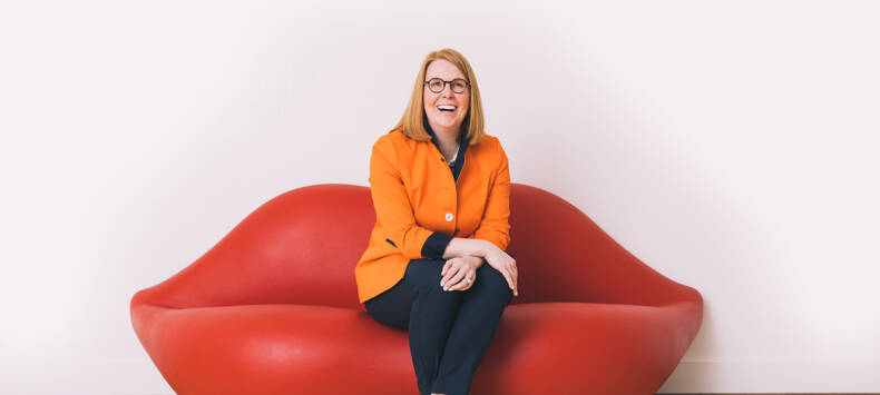 president summer mcgee posing on couch