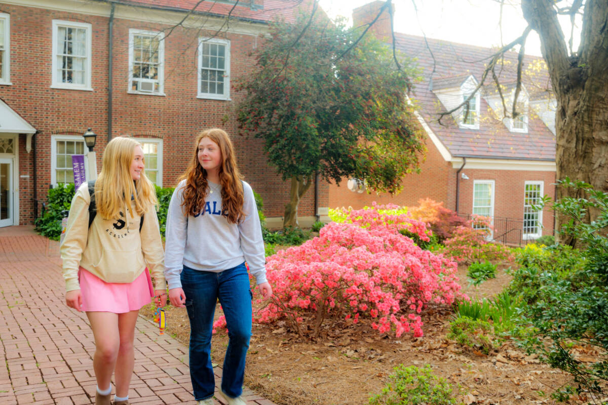 Academy students walking from the Science building in the center of campus