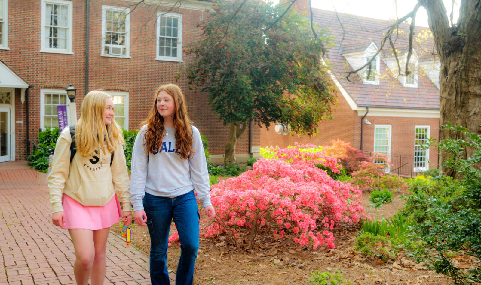 Academy students walking from the Science building in the center of campus