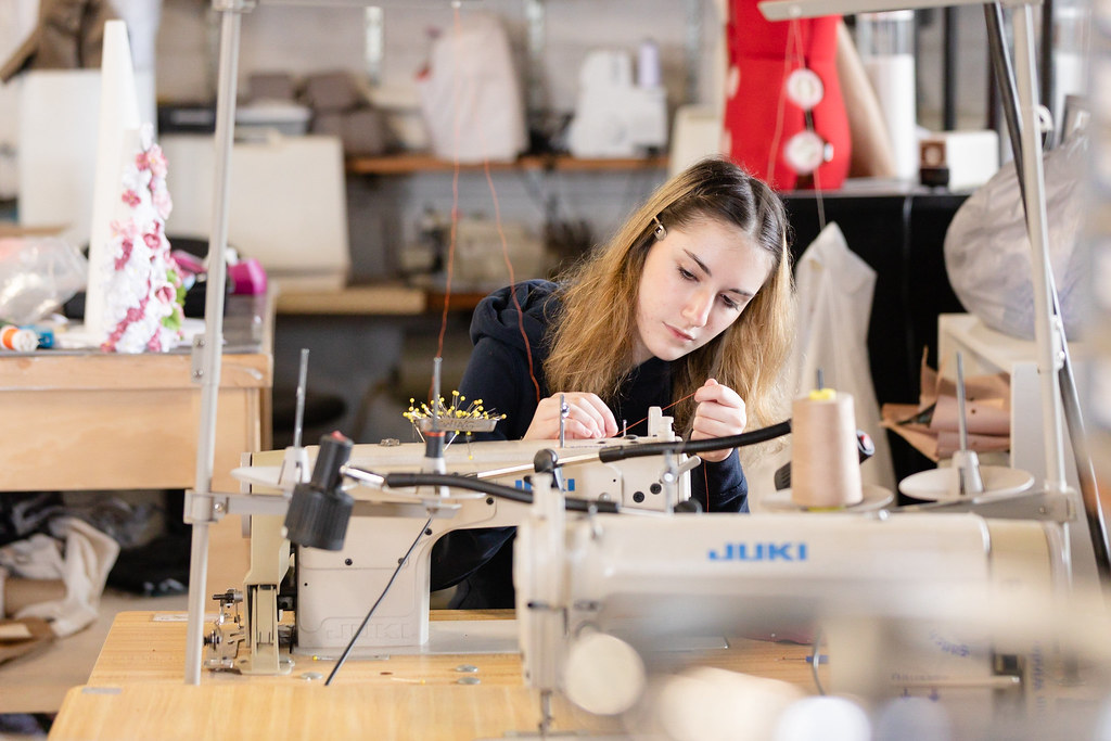 student working with sewing machine