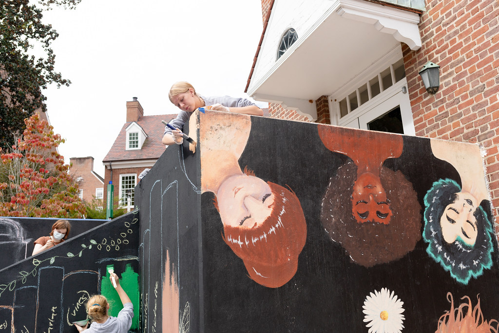 students painting staircase