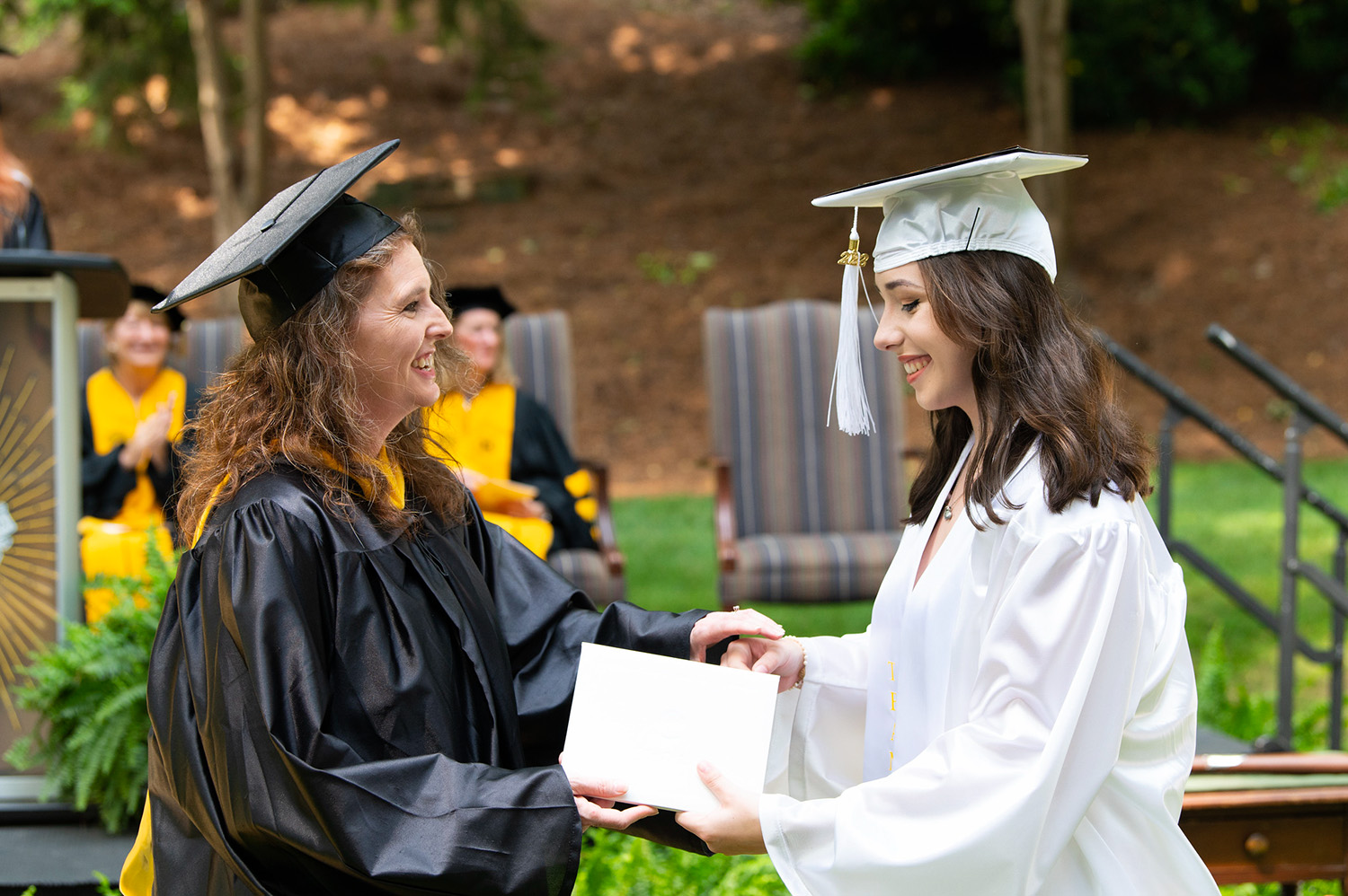 student receiving diploma