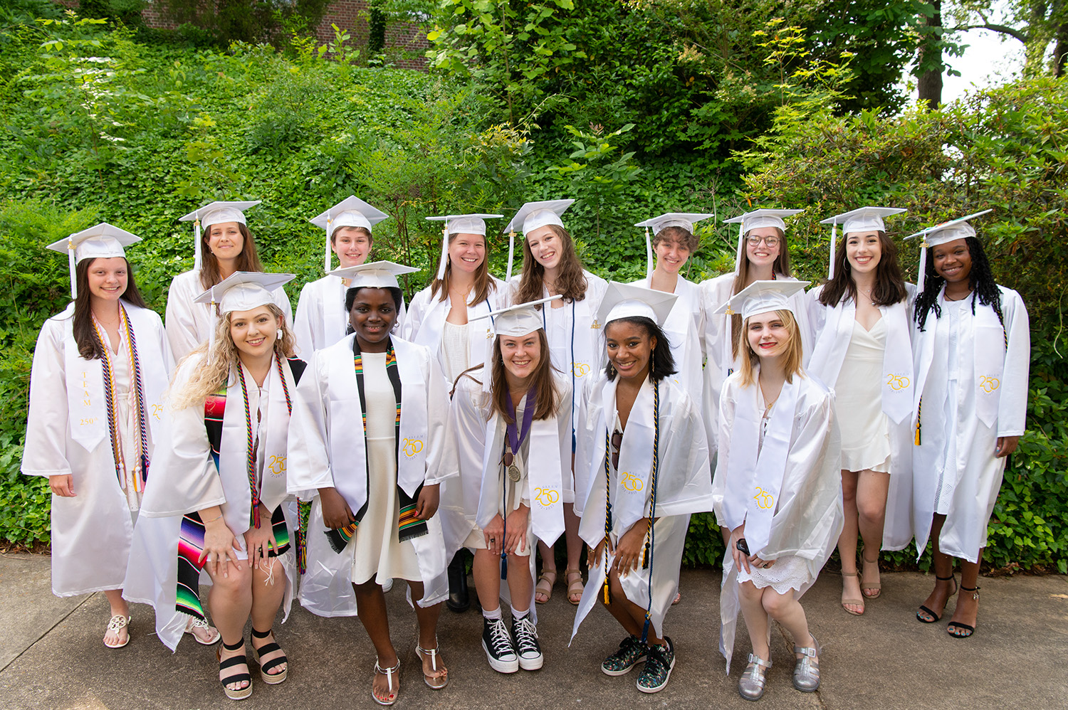 graduates posing together